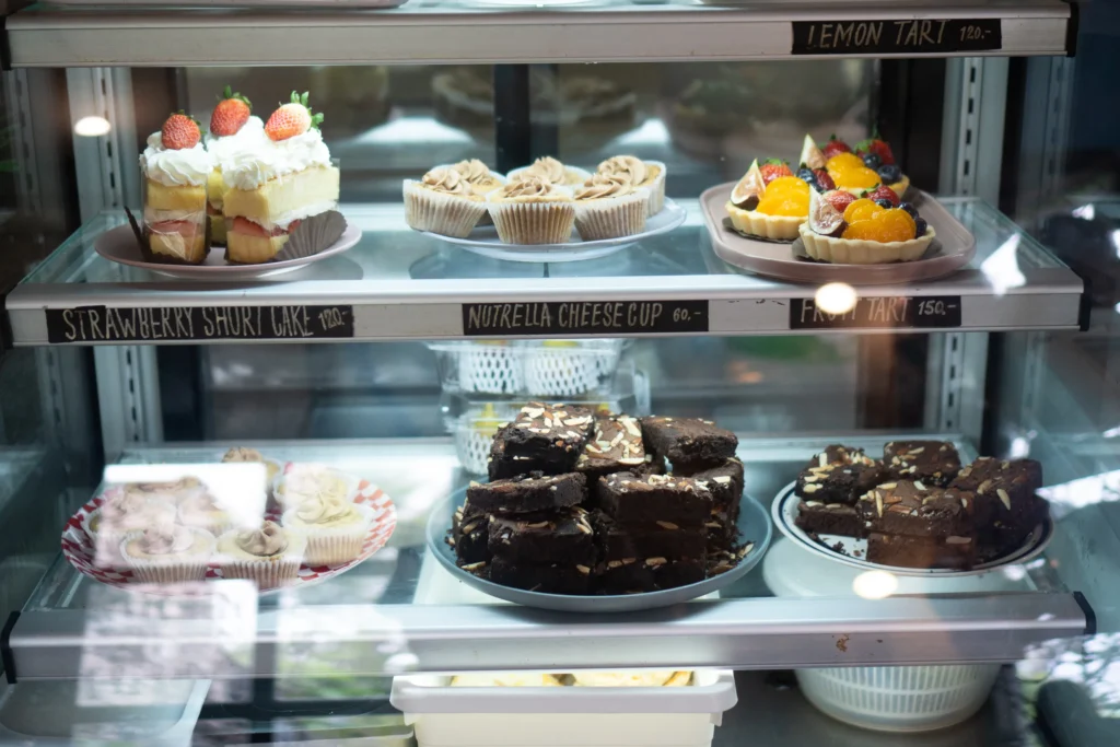 Freshly baked pastries and sweet treats are beautifully displayed in a Cake Display Fridge